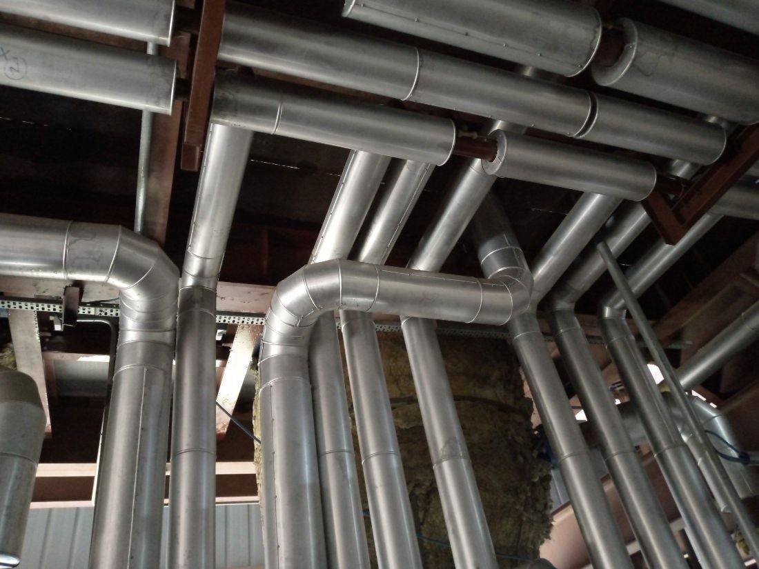 Overhead steam and condensate lines clad