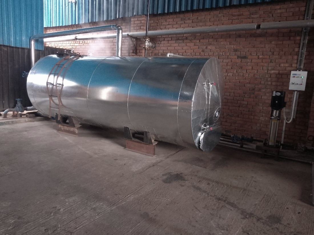 Horizontal tank clad in galvanised sheet with banding